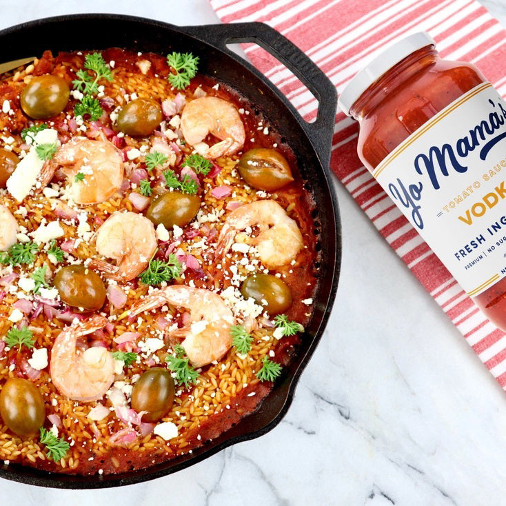 A jar of YO MAMA'S VODKA SAUCE by YO MAMA'S FOODS. The label indicates it's made with fresh ingredients, is all-natural, KETO certified, contains no sugar, and is gluten-free. Handmade in small batches, the jar has a net weight of 25 oz (708g).