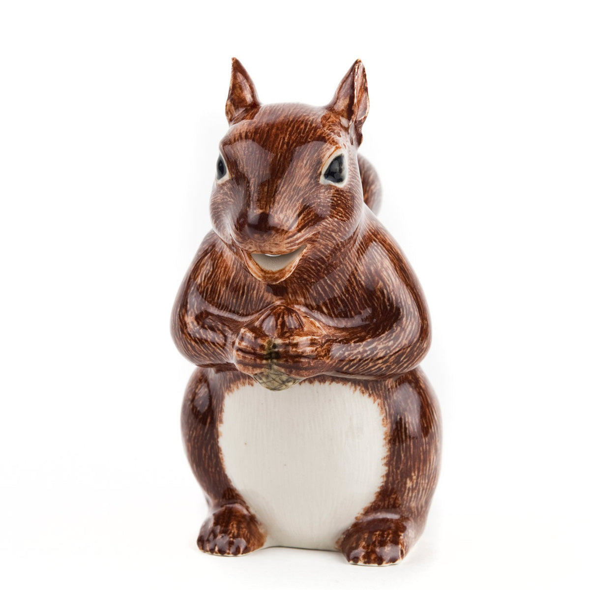 The QUAIL CERAMICS - SQUIRREL JUG by QUAIL DESIGNS is a hand-painted stoneware figurine depicting a brown squirrel with a white belly, standing upright and holding its paws together against a plain white background.