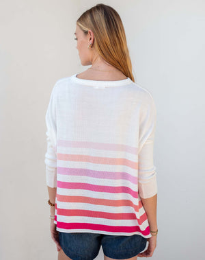 Woman wearing the MERSEA - CATALINA CREWNECK SWEATER, white with two black stripes, paired with denim shorts and a gold necklace—an essential piece from MERSEA for effortless, versatile style.