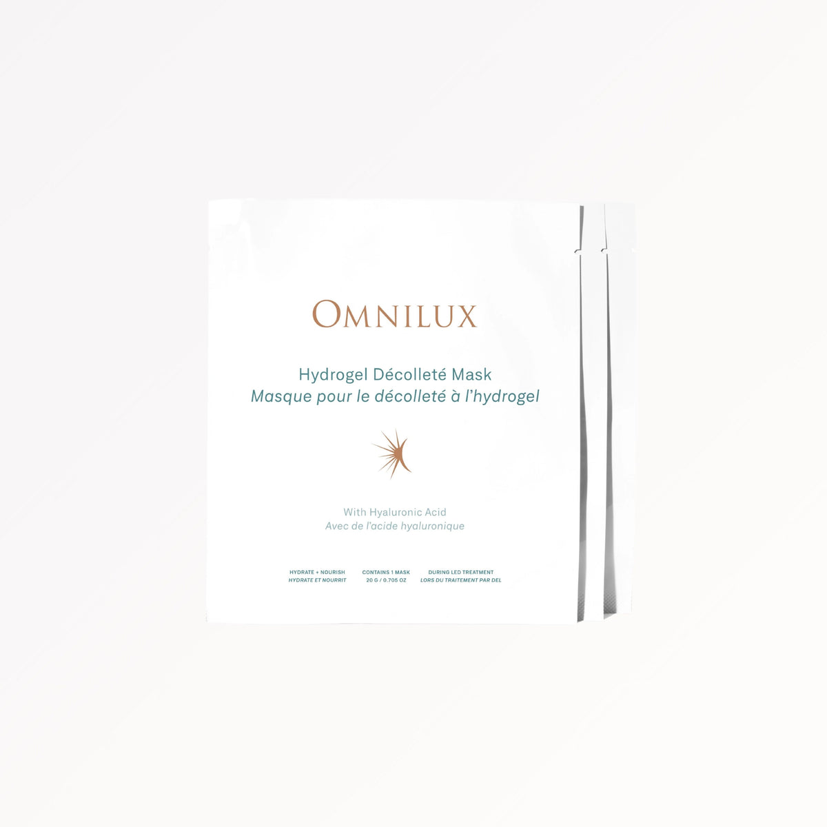 A woman smooths OMNILUX Hydrogel Décolleté Mask onto her shoulder, elevating her skincare routine with this advanced treatment from OMNILUX. The formula features standout ingredients—hyaluronic acid for deep hydration, niacinamide to refine skin texture, and green tea extract for soothing care and antioxidant protection. For amplified results, pair with OMNILUX LED treatments to further enhance the rejuvenating effects.