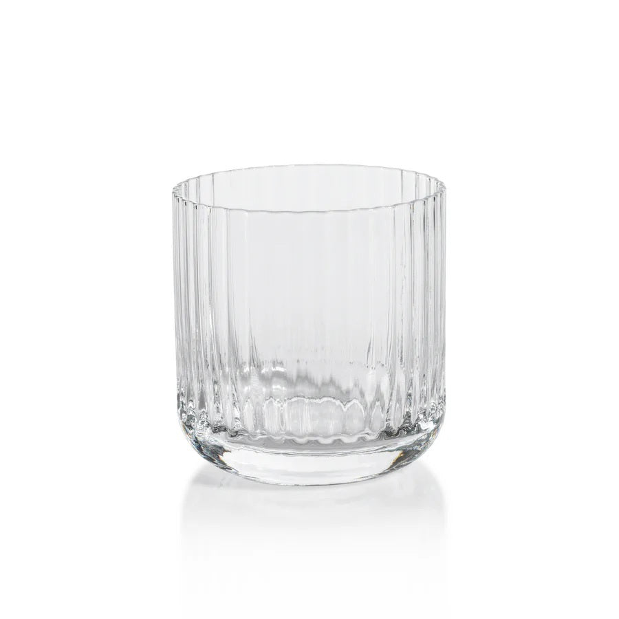 The SAVOY DOUBLE OLD FASHIONED GLASS by ZODAX, featuring clear ribbed glass with vertical ridges, sits on a white background and casts a soft reflection below.