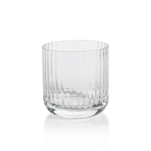 The SAVOY DOUBLE OLD FASHIONED GLASS by ZODAX, featuring clear ribbed glass with vertical ridges, sits on a white background and casts a soft reflection below.