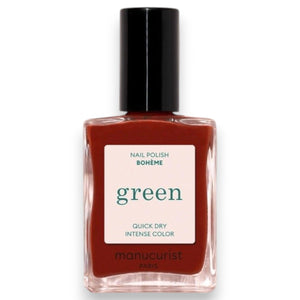 A close-up of MANUCURIST - GREEN™ NAIL POLISH IN BOHEMIAN by MANUCURIST INC being smoothly applied with a brush, revealing its glossy, reflective red finish and visible bristle strokes.
