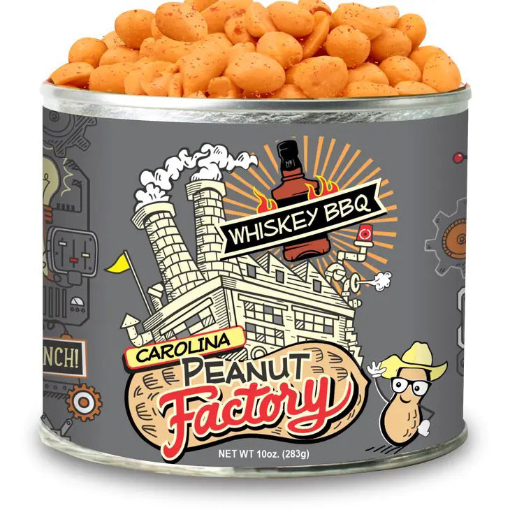 A cylindrical metal can with a label showcasing a cartoon factory and text reading &quot;1949 NUT COMPANY&quot; and &quot;Whiskey BBQ.&quot; The can is brimming with seasoned peanuts, featuring a peanut character in a cowboy hat. Net weight: 10 oz (283g).