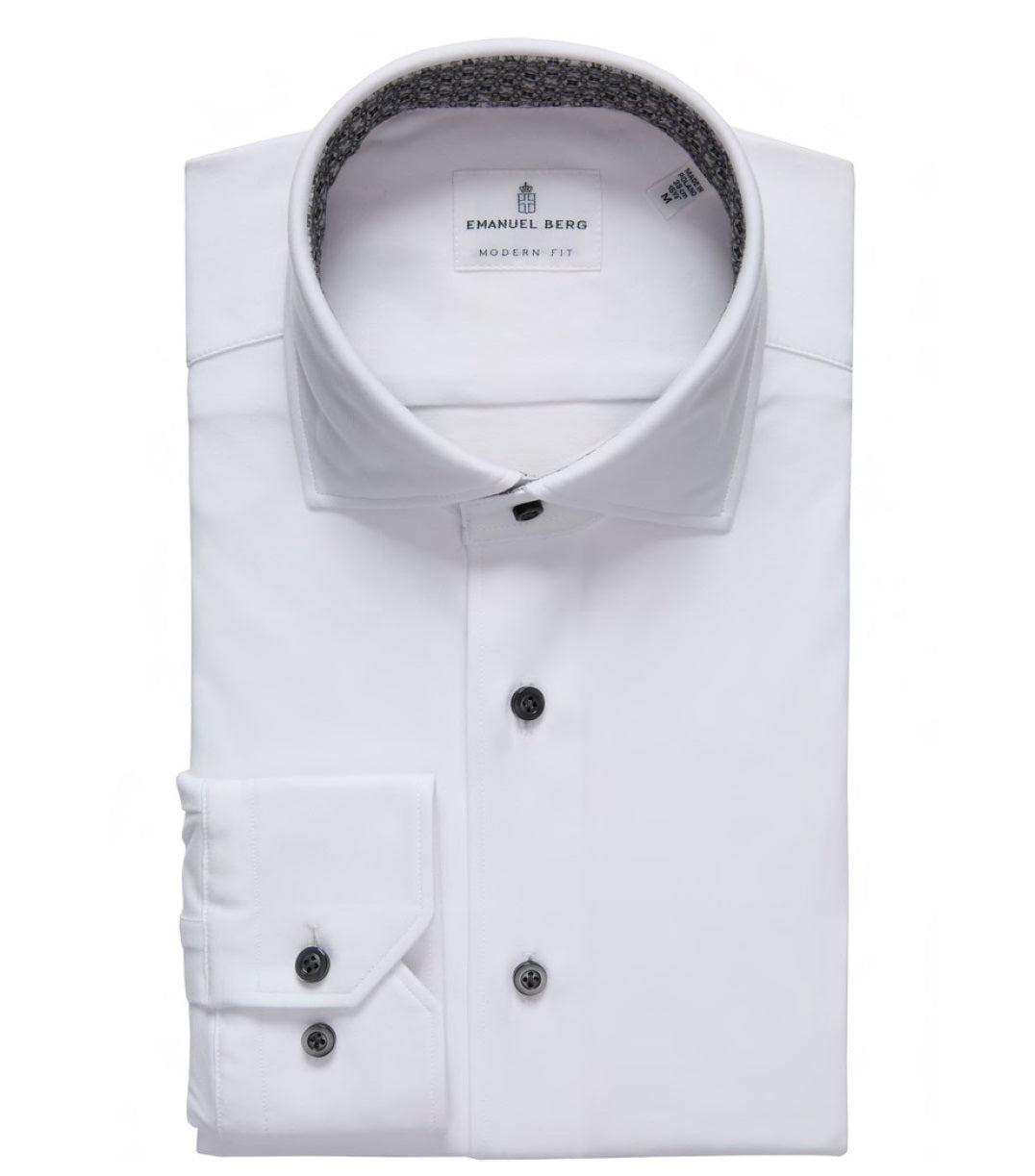 The EMANUEL BERG - MODERN 4 FLEX STRETCH KNIT SHIRT IN WHITE features black buttons, a patterned inner collar, and four-way stretch fabric—offering stylish comfort for today's wardrobe.
