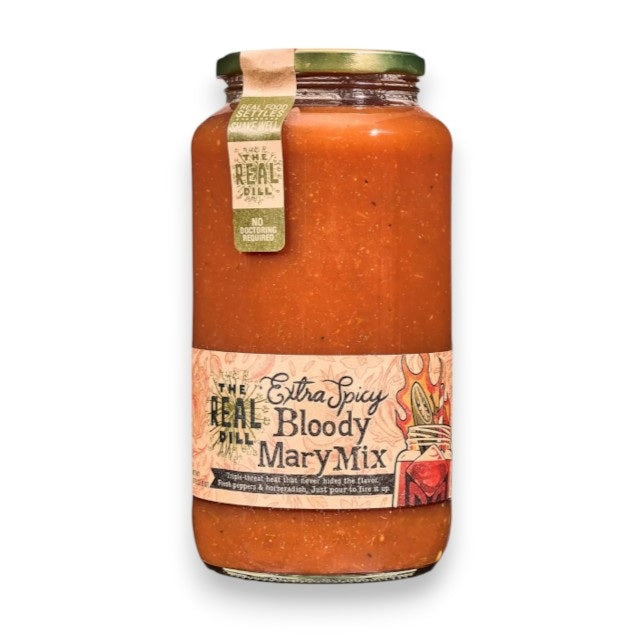A 32oz jar of THE REAL DILL - EXTRA SPICY BLOODY MARY MIX, a bold and spicy dill pickle bloody mary mixer from THE REAL DILL, featuring an illustrated label with a cocktail and filled with thick orange-red liquid—perfect for spice lovers seeking the ultimate cocktail mixer.