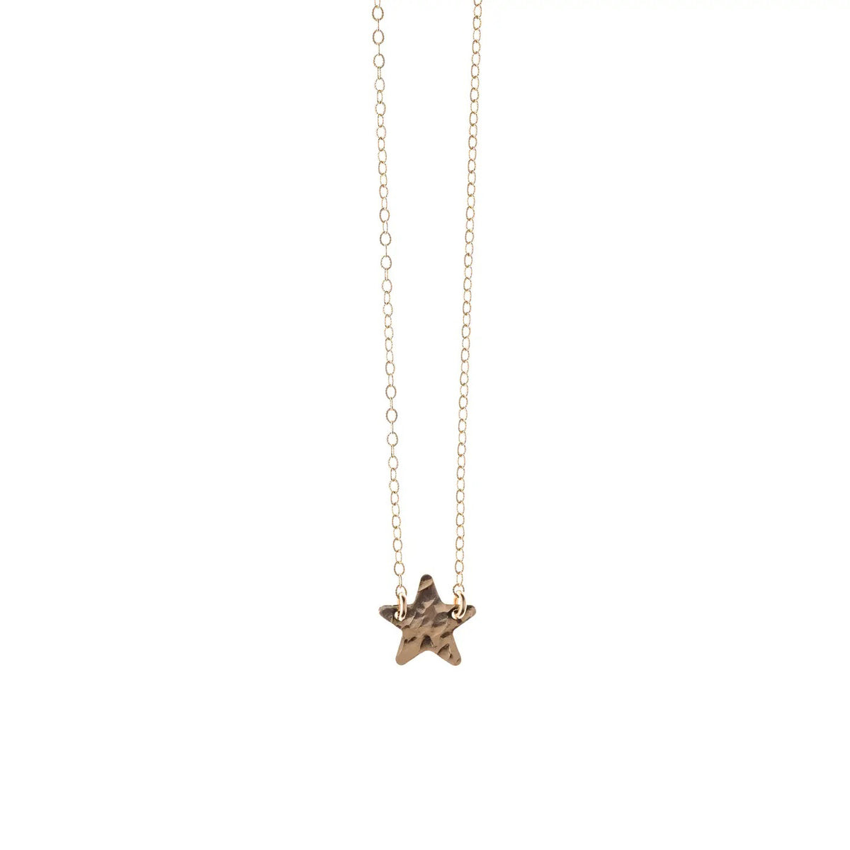The KENDA KIST - STAR NECKLACE by KENDA KIST features a delicate 14k gold filled star charm, beautifully displayed against a white background.