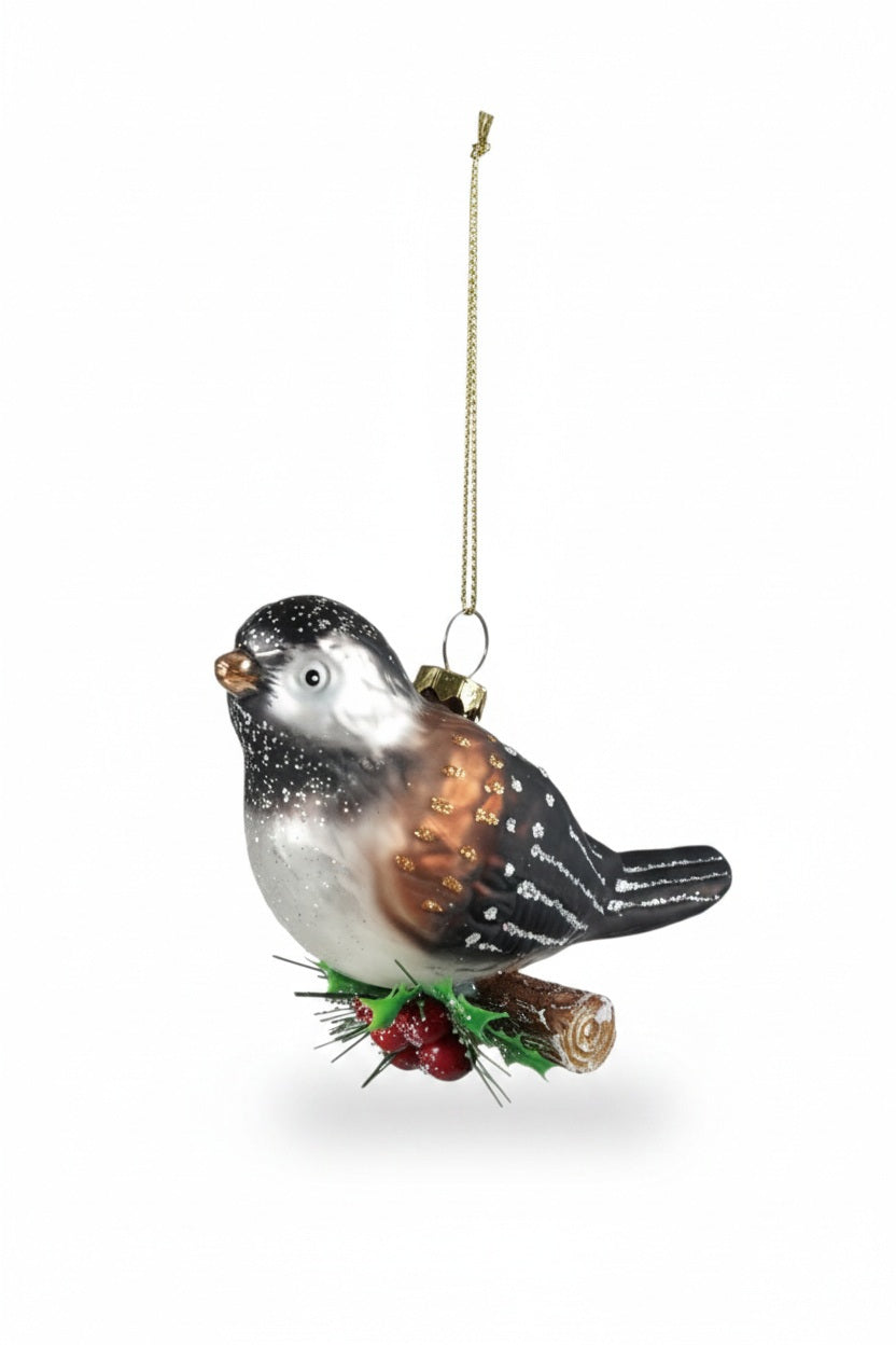 HAND PAINTED CHICKADEE ON BRANCH ORNAMENT featuring a chickadee perched on a small branch with red berries and green needles.
