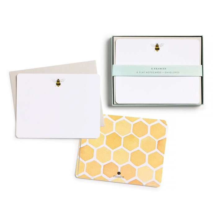 The E. FRANCES - FLAT NOTES BEE by E. FRANCES PAPER features illustrated bee stationery with a yellow honeycomb pattern on the back—perfect for hand-written notes. Set is pictured partially opened.