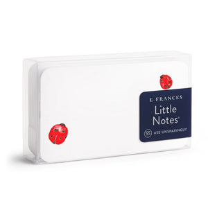 E. FRANCES PAPER's E. FRANCES - LITTLE NOTES LADYBUG features a rectangular stack of mini note cards with red flower accents on the front, green leaf pattern on the back, and comes packaged reading "Little Notes." Yellow pencil shown for scale.
