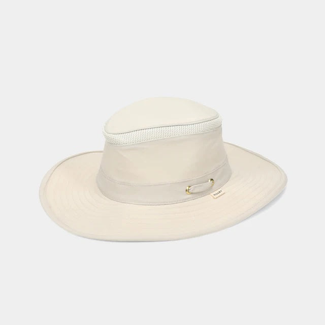 The TILLEY AIRFLO BROAD BRIM HAT LTM6 in Light Stone is a recycled nylon sun hat with UPF 50+ protection, wide brim, mesh ventilation near the crown, and a small band tag. Shown on a plain white background.