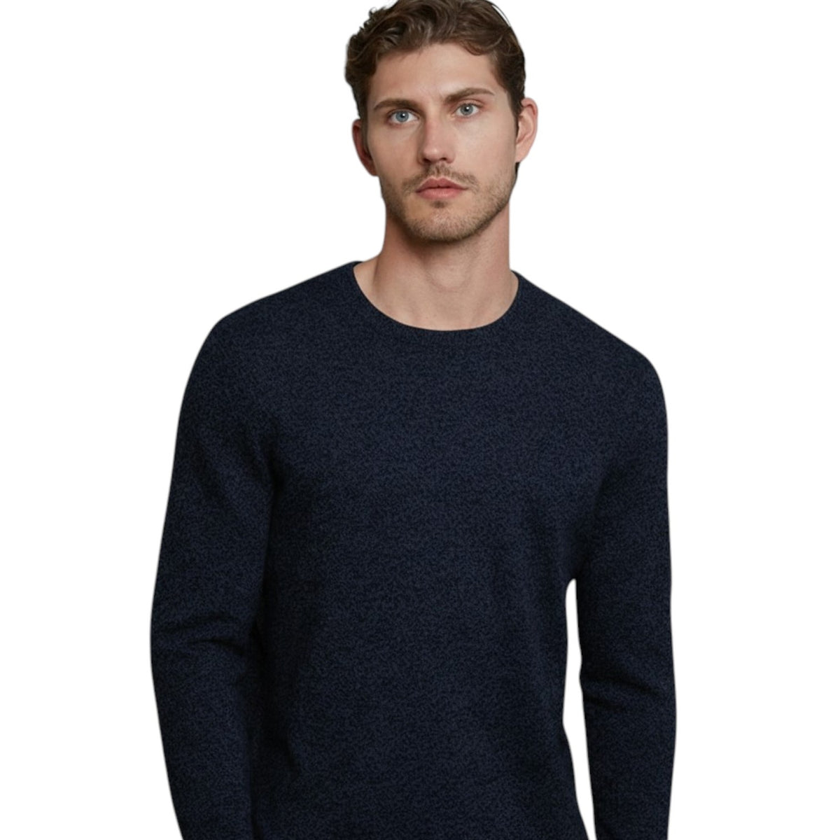 A man with short brown hair stands with his hands in his pockets against a white background, wearing the AUTUMN CASHMERE - Cashmere Basic Crew Neck with Rib Bottom in Midnight and blue jeans.