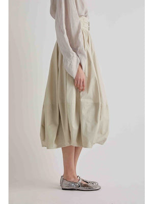 A rich oak brown fills the image, resembling a blank canvas ready to showcase the bold form of the MEIMEIJ - BALOON SKIRT IN OAK by MEIMEIJ.