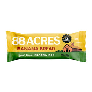 The 88 ACRES - BANANA BREAD HIGH PROTEIN BAR is shown wrapped, with packaging featuring cinnamon sticks, banana slices, and seeds. This nut-free bar is labeled "12g protein," "vegan," "gluten-free," and "no palm oil.