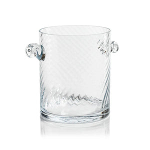 The BAGATELLE SWIRL GLASS ICE BUCKET by ZODAX features a clear, textured spiral design with diagonal swirls and two round handles—a modern bar accessory shown on a white background.