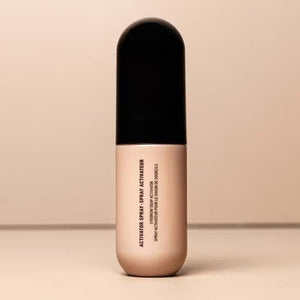 A beige and black cylindrical bottle of JASON WU BEAUTY's "MIST-ER SOAP STAR BROW SOAP" is centered against a neutral background. The minimalistic design features black text on the front, enhancing its sleek aesthetic.