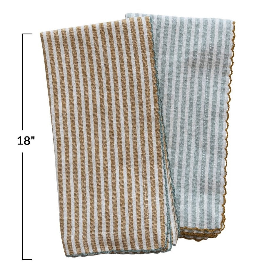 The CREATIVE COOP STRIPED COTTON NAPKIN WITH SCALLOP TRIM comes in aqua or mustard. Each 18" reusable napkin adds a stylish touch to your table linens collection.