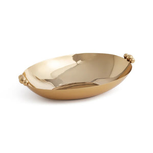 Introducing the POLISHED GOLD SERVING BOWL by ZODAX, an elegant oval-shaped brass bowl with decorative round handles on each end, showcased gracefully against a white background.