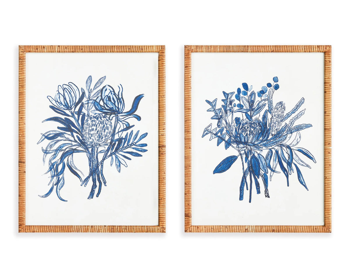 The NAPA HOME AND GARDEN - BANKSIA BOUQUET PRINT offers two framed artworks with blue botanical illustrations and rattan-wrapped frames; one features abstract florals, and the other showcases monochromatic bouquets in soothing tones, perfect for in-store pickup to enhance your decor.