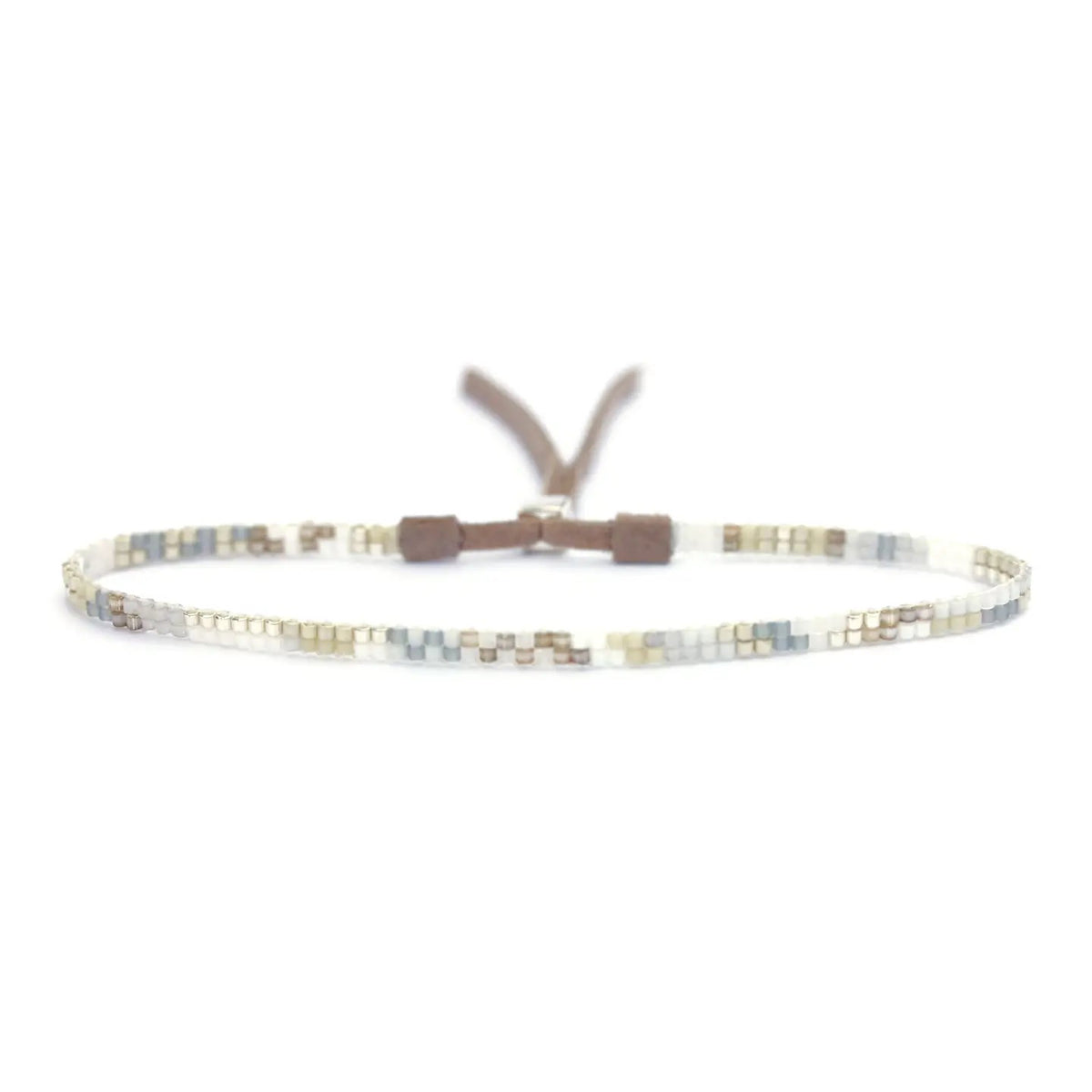 The JULIE ROFMAN - MINI BRACELET by JULIE ROFMAN JEWELRY is a vibrant handwoven piece adorned with small, square beads in various shades of pink, red, and white. It is displayed against a white background and includes a straightforward sterling silver clasp for convenient fastening.