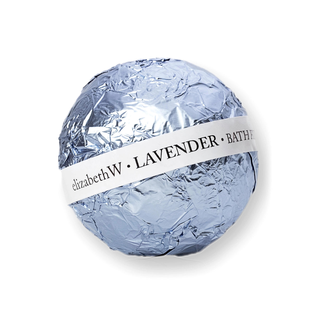 A nourishing bath fizz ball wrapped in crinkled silver foil, with a white label around it displaying the text &quot;E WIGHTMAN &amp; CO BATH FIZZ BALL LAVENDER&quot;.