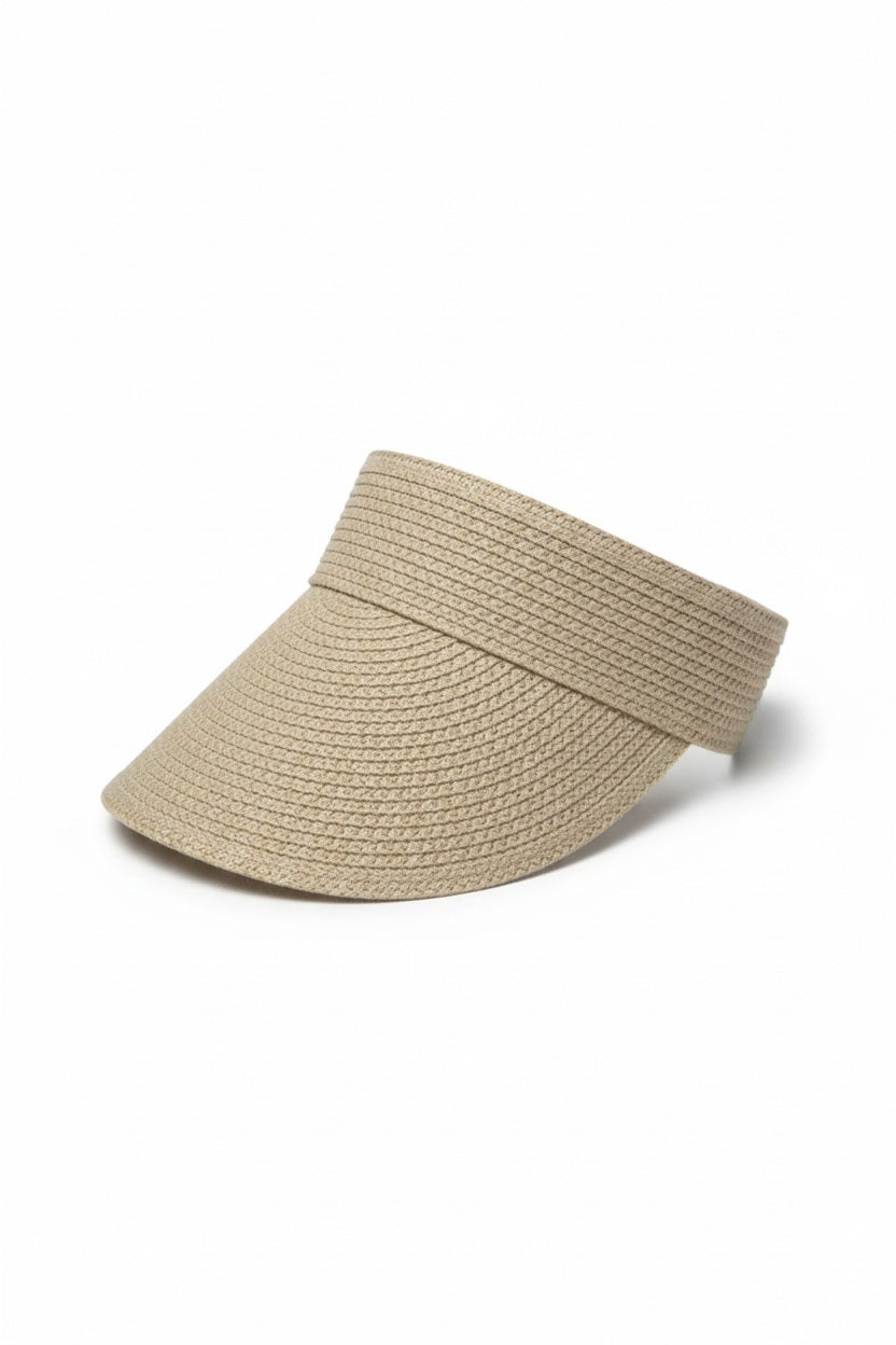 A woman with long, light brown hair wears the BEACH HARE - JUNIE VISOR by BEACH HARE and a mauve sleeveless top, looking to her right against a plain light background. The visor is handmade in NY.