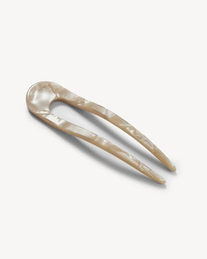 A smooth, black MACHETE - FRENCH HAIR PIN with two prongs, crafted from Italian acetate by MACHETE, rests on a plain white surface.