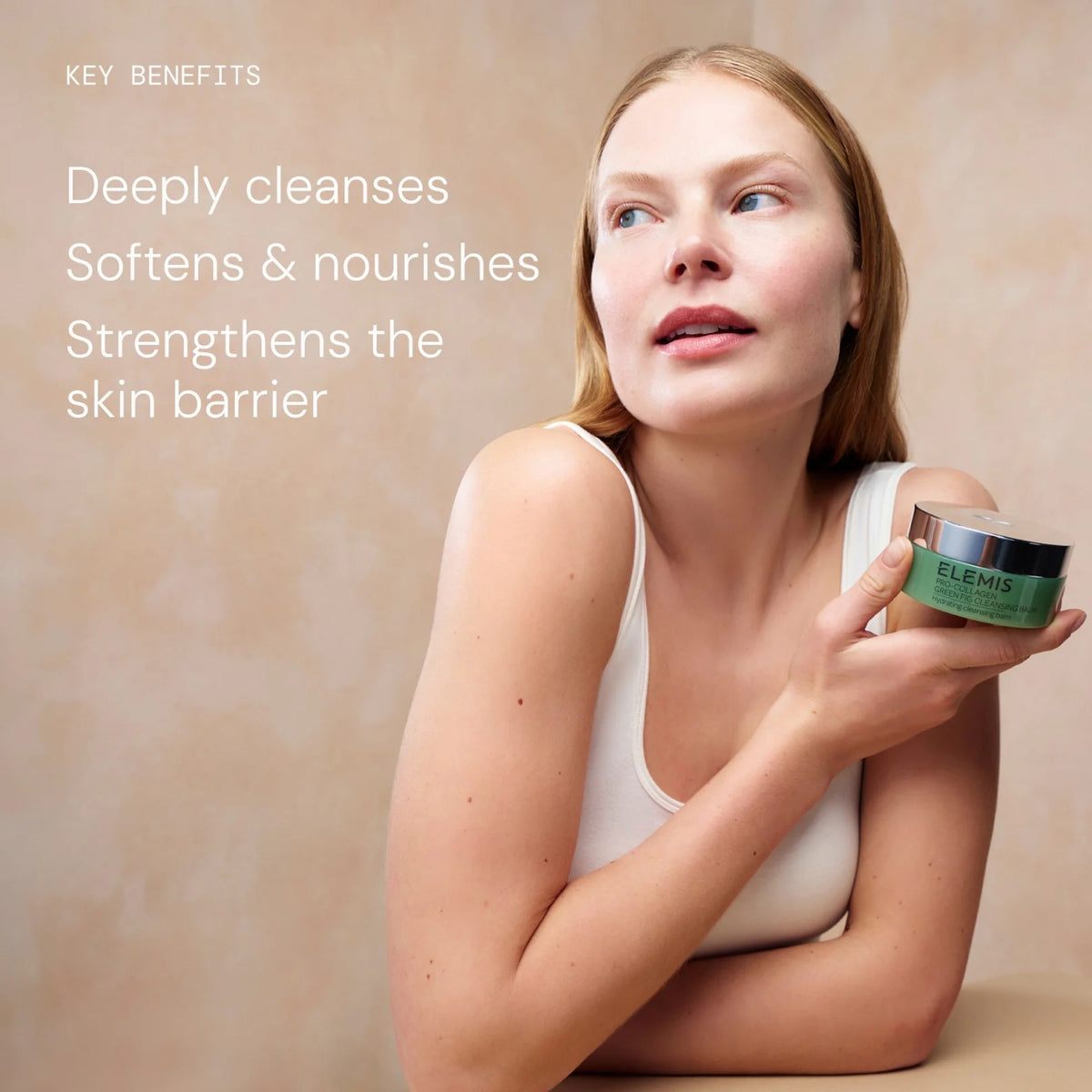 Three textured swatches—yellow, pearly white, and translucent—overlap on a pale background. Text reads: “3-in-1 transformative texture. Rich balm, nourishing oil, hydrating milk.” Experience the multi-tasking power of ELEMIS - PRO-COLLAGEN GREEN FIG CLEANSING BALM by ELEMIS - STEINER—a luxurious facial cleansing balm that also acts as an effective makeup remover.