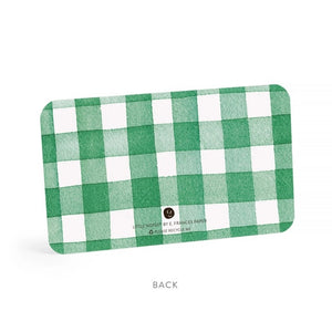 The E. FRANCES - LITTLE NOTES DUO STRAWBERRY card by E. FRANCES PAPER is rectangular with rounded corners and a green and white checkered pattern. “BACK” is printed below, along with small text and a recycling symbol at the bottom center.