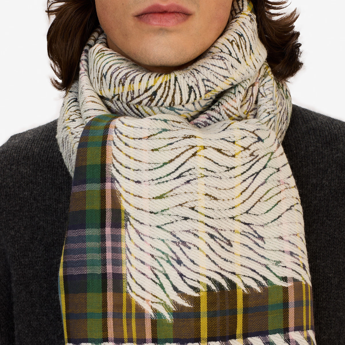 A person wears the INOUI FREDDY DOGS 3D Wool Scarf in Khaki by INOUI, featuring a unique jacquard design, against a plain white background. Made in India.