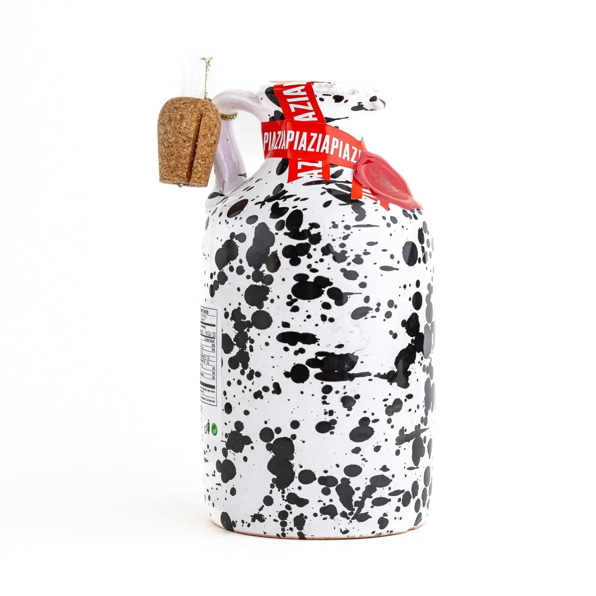 Introducing the GALANTINO - LEMON EXTRA VIRGIN OLIVE OIL from ZIA PIA IMPORTS: a hand-painted ceramic bottle with a cork, featuring a white finish adorned with black splatter patterns and red accents. Standing upright on a white background, it’s perfect for presenting your favorite flavored olive oil.