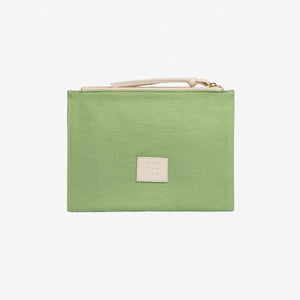 The INOUI EDITIONS - PARIS 7TH ARRONDISSMENT POUCH by INOUI is a rectangular Italian leather pouch with green and navy stripes, an illustrated open book with flowers and a building, plus a white zipper and wrist strap.