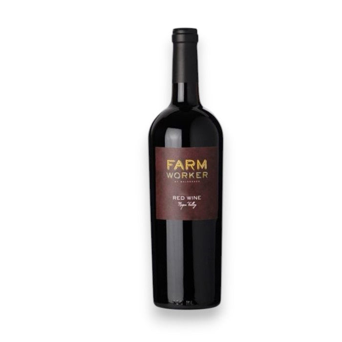 A bottle of MALDONADO FARM WORKER RED 2018 by WINE: OCEAN SOUTH IMPORTS, featuring a dark red and gold label, stands upright against a plain white background.