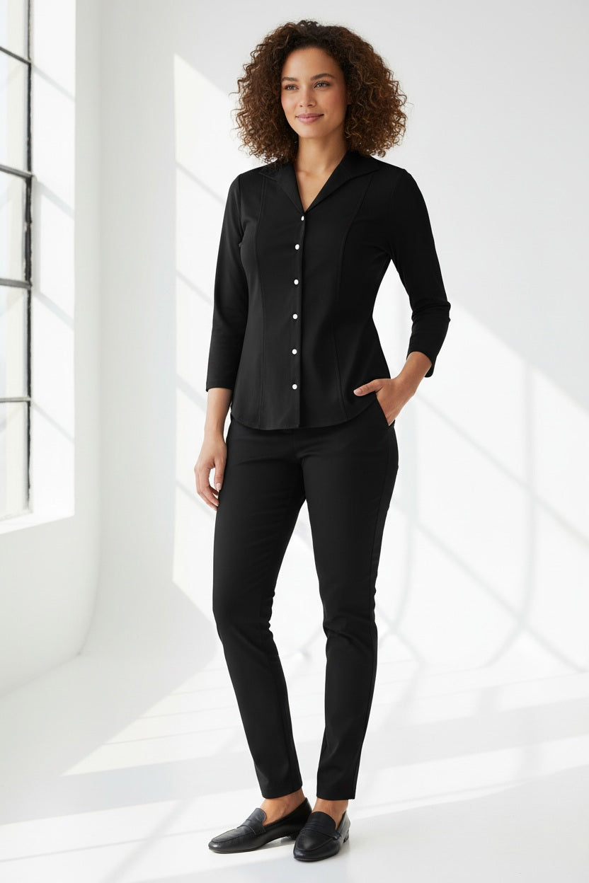 A woman with blonde hair tied back is wearing the HINSON WU DONNA 3/4 SLEEVE TOP and black pants, standing against a plain light background and looking at the camera.