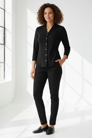 A woman with blonde hair tied back is wearing the HINSON WU DONNA 3/4 SLEEVE TOP and black pants, standing against a plain light background and looking at the camera.