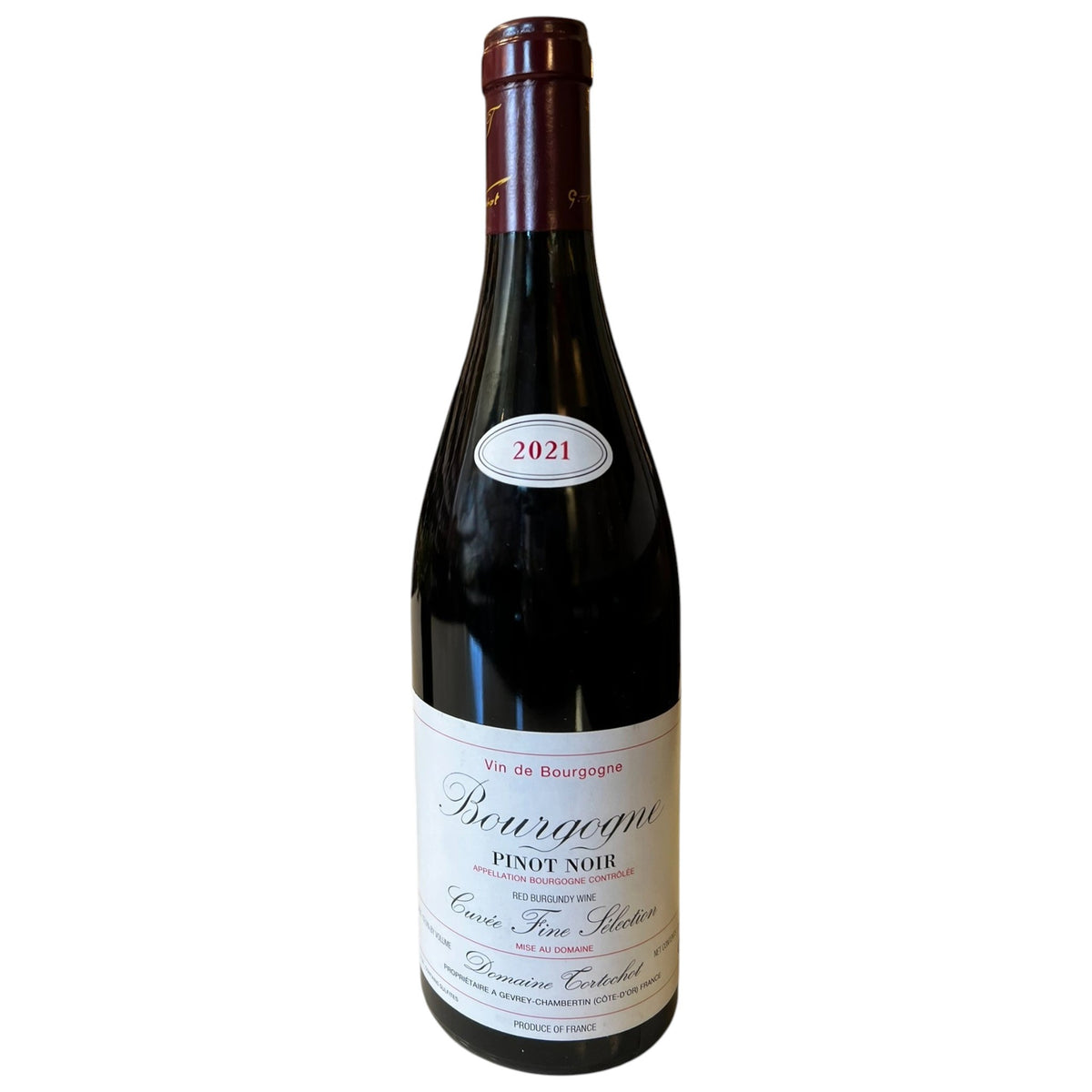 A bottle of TORTOCHOT BOURGOGNE PINOT NOIR 2021 with a white label and a small “2021” label on the bottle neck.