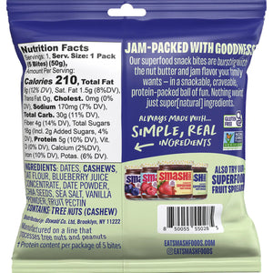 A bag of CHIA SMASH - CASHEW BUTTER AND BLUEBERRY SNACK BITES displays a blueberry filling, fresh blueberries, and emphasizes that it is gluten-free, vegan, with 5g of protein.