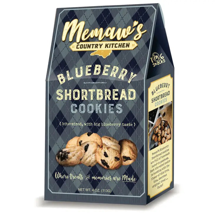 A box of MEMAWS COUNTRY KITCHEN - BLUEBERRY SHORTBREAD by 1 IN 6 SNACKS features blueberries, homemade cookies on vintage-style blue packaging, and the phrase “Where treats & memories are made.”.