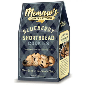 A box of MEMAWS COUNTRY KITCHEN - BLUEBERRY SHORTBREAD by 1 IN 6 SNACKS features blueberries, homemade cookies on vintage-style blue packaging, and the phrase “Where treats & memories are made.”.