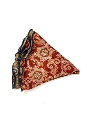 The EDWARD ARMAH Silk Reversible Pocket Circle in Olive Medallion features a greenish-brown base with medallion floral prints, a visible red section with detailed patterns, and dark blue edging.