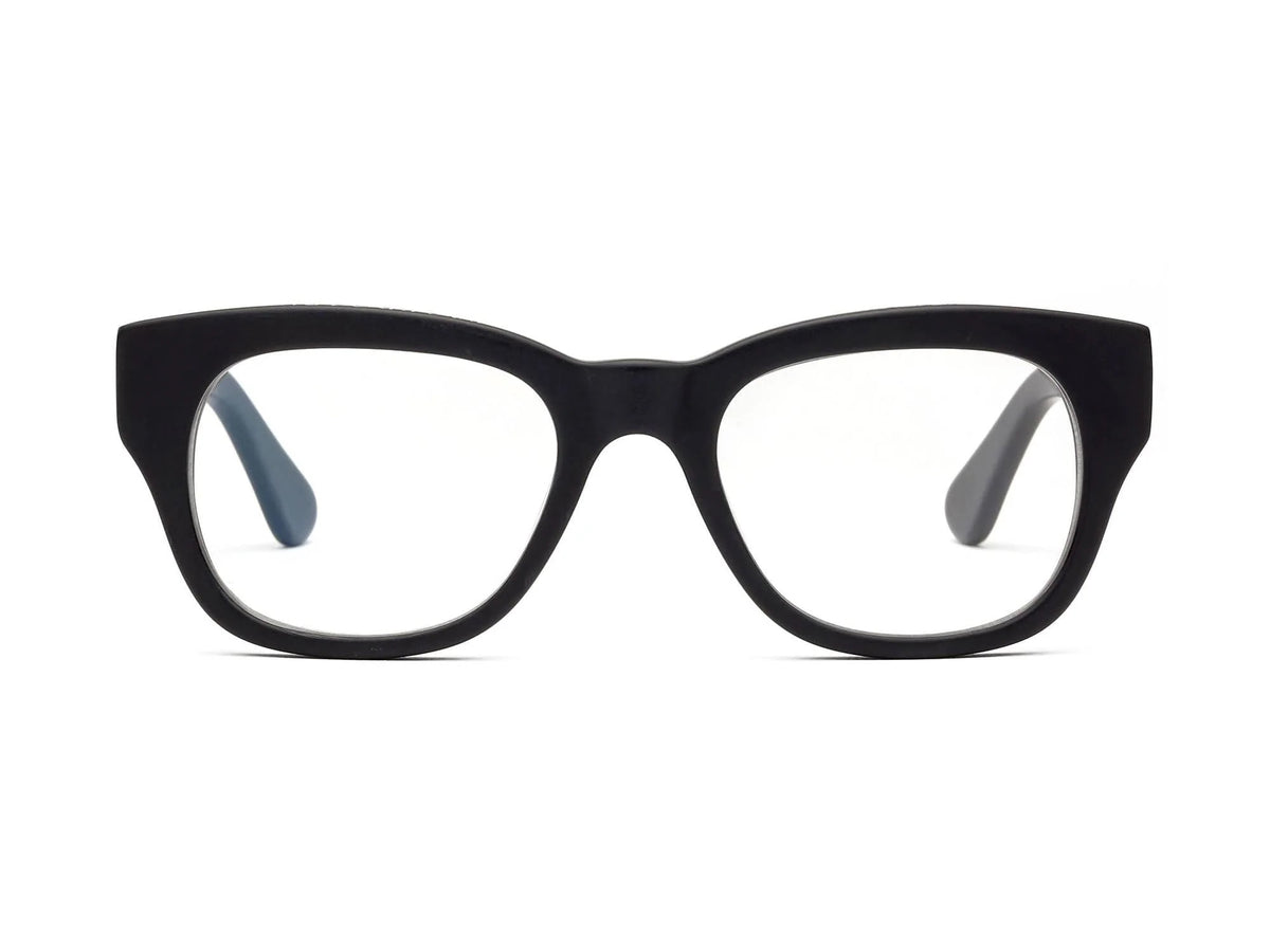CADDIS - MIKLOS READERS by CADDIS, featuring black rectangular bio-based acetate frames with a thick design, displayed at an angle on a white background.