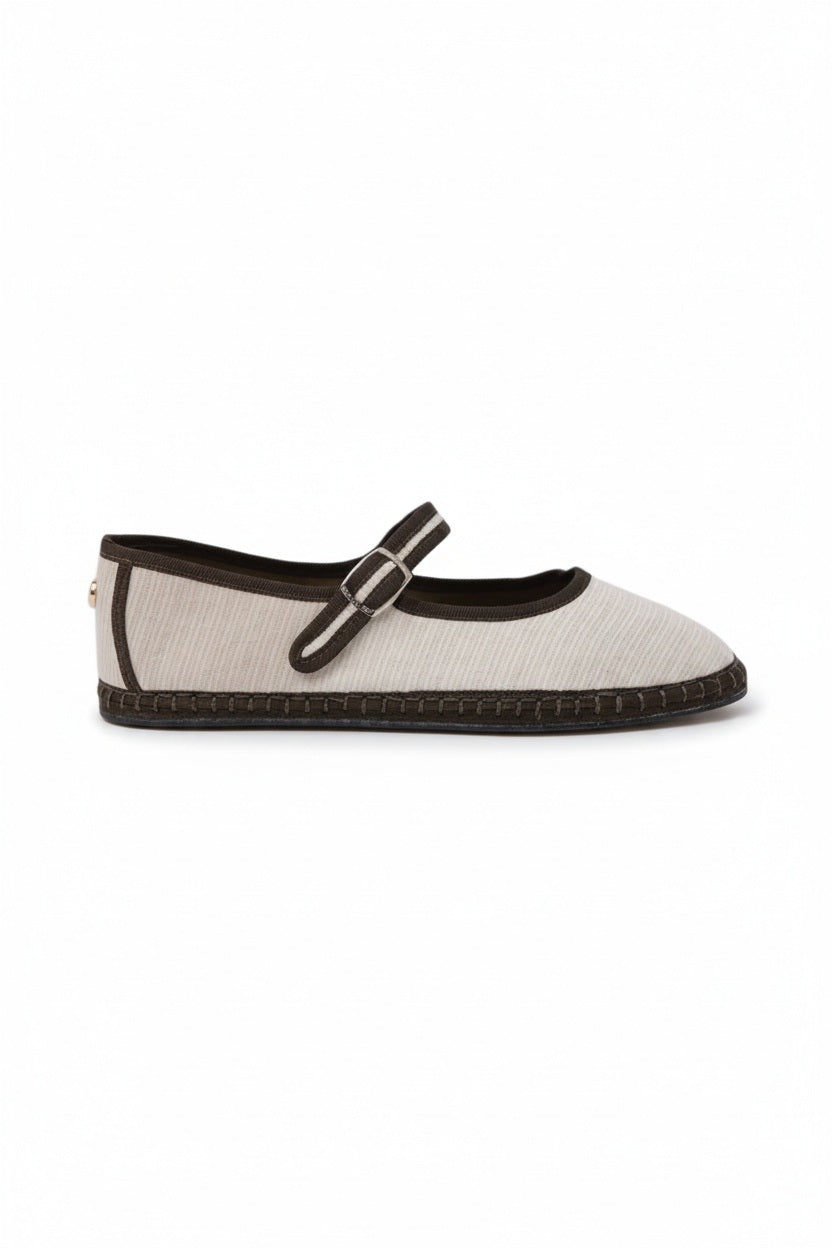 The SVETI STEFAN - MARY JANE SHOE by SVETI STEFAN is a light blue cotton flat with a textured surface, red trim, gel insole, and silver buckle strap, shown against a plain light background.