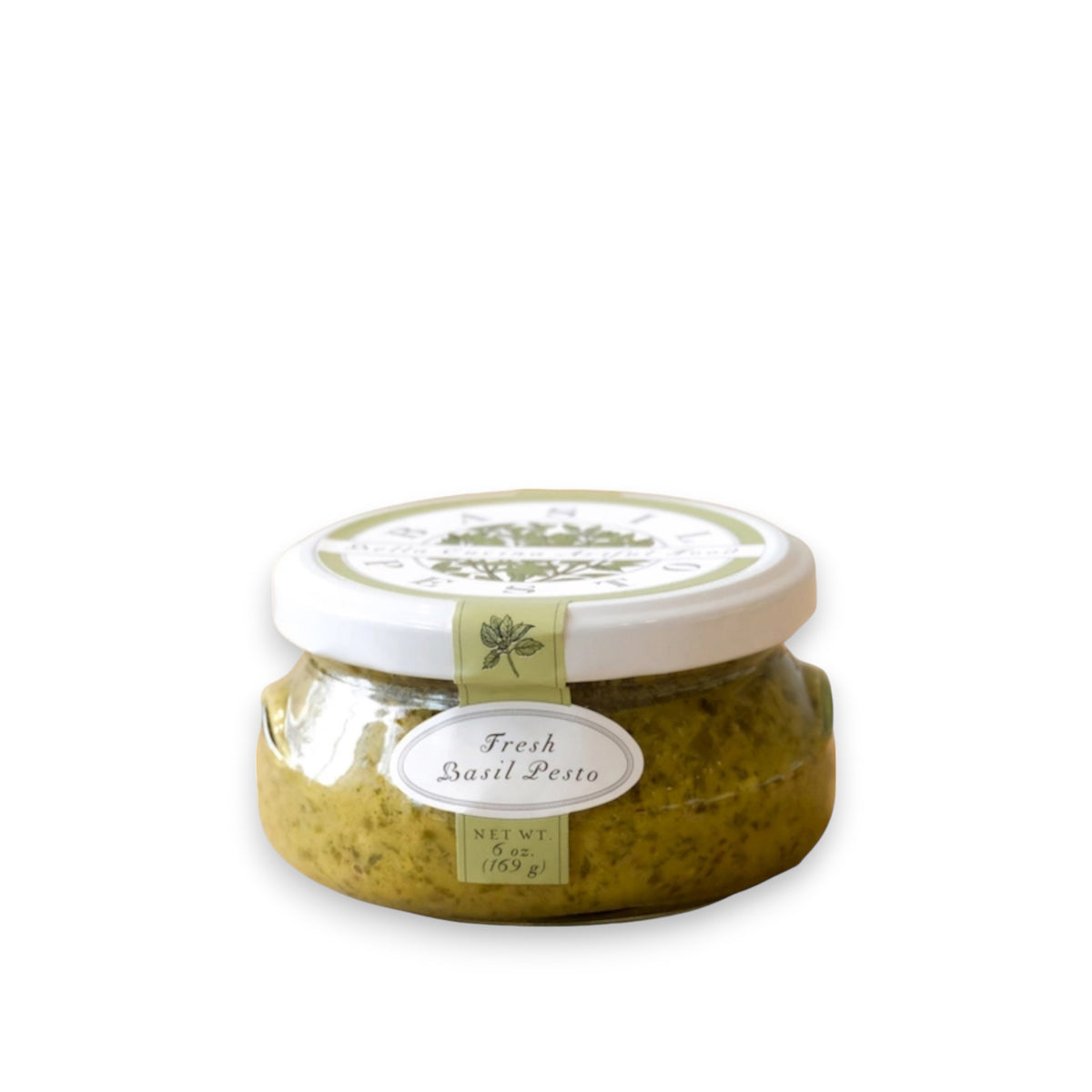 A small glass jar of BELLA CUCINA - FRESH BASIL PESTO sits against a white background. The jar has a white lid and a green seal with a basil leaf illustration. A label on the front reads "BELLA CUCINA - Fresh Basil Pesto, Net Wt 6.5 oz (185g), Made in United States." The jar's contents are visible through the glass.