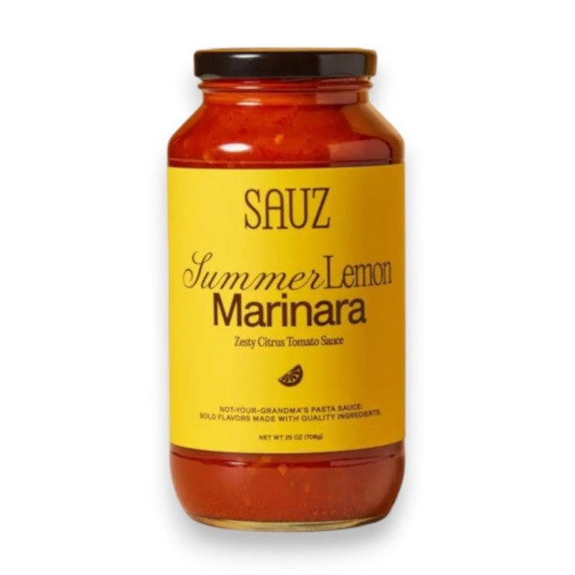 A jar of SAUZ Summer Lemon Marinara, featuring a vibrant yellow label with “Zesty Citrus Tomato Sauce,” showcases bold, savory flavors made from locally-sourced ingredients.