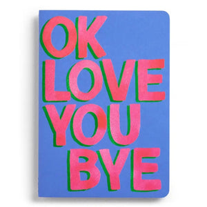 This E. FRANCES PAPER set includes two stitched OKLOVEYOUBYE notebooks, each 8.5 x 6 inches with soft covers, 26 ruled pages, and bold pink and green “OK LOVE YOU BYE” text on blue.