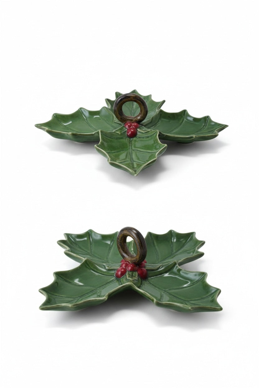 Two green CREATIVE COOP CERAMIC HOLLY LEAF SHAPED DISH serving platters, one with three sections and one with four, each featuring a central dark ring handle and red berries.