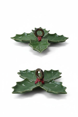 Two green CREATIVE COOP CERAMIC HOLLY LEAF SHAPED DISH serving platters, one with three sections and one with four, each featuring a central dark ring handle and red berries.