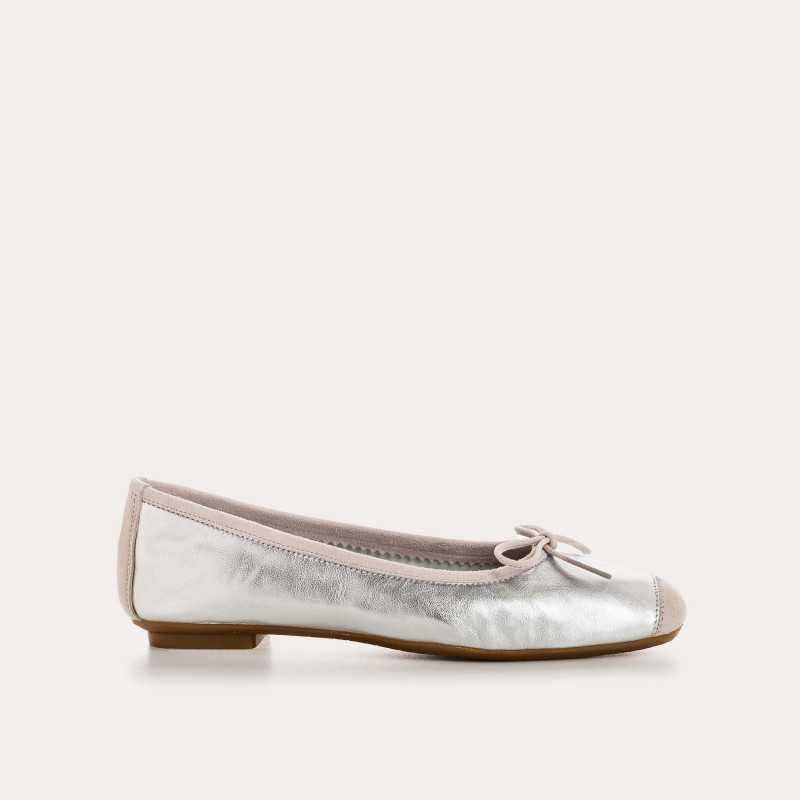 Top view of the REQINS - HARMONY BALLERINA FLATS IN METALIC SILVER by REQINS, featuring shimmering silver leather and a front bow, captured on a plain light background for a chic metallic look.