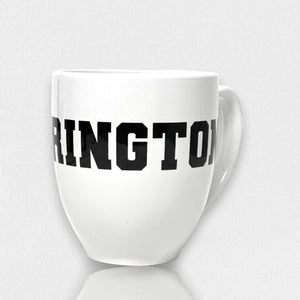 The FEARRINGTON LIFESTYLE COLLECTION - FEARRINGTON MUG by STRAN features the word "FEARLESS" boldly displayed in black, capital letters across its front. Perfect for your morning coffee, this ceramic mug rests on a white surface with a subtle shadow. The clean and minimalistic backdrop highlights its sleek design.