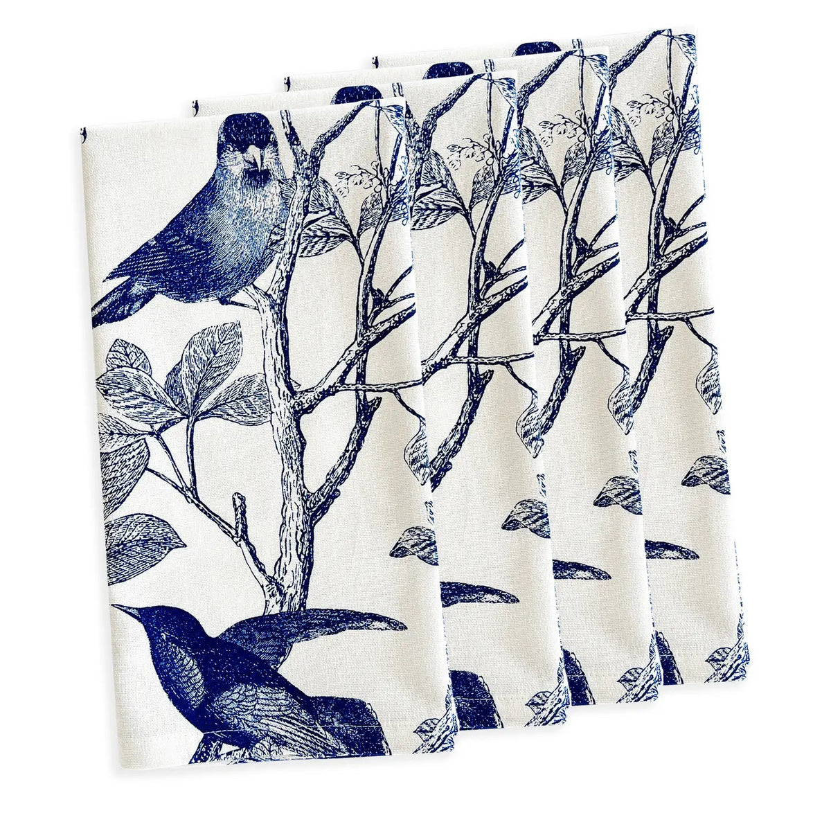 Four white cotton CASKATA - ARBOR BIRDS DINNER NAPKINS by CASKATA, made in India, are neatly stacked and display a repeating pattern of green birds on leafy branches.